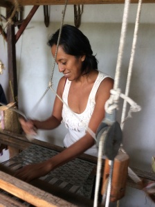 Abrazo Style Oaxaca artisan Carmen weaving a scarf by hand.